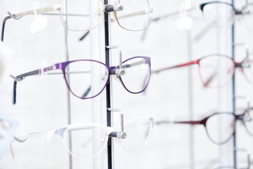 Sideview of fashionable optical eyeglasses, hanging on transparent set with other glasses. Vision improving and protecting. Appointing after medical examination. (Envato Elements)