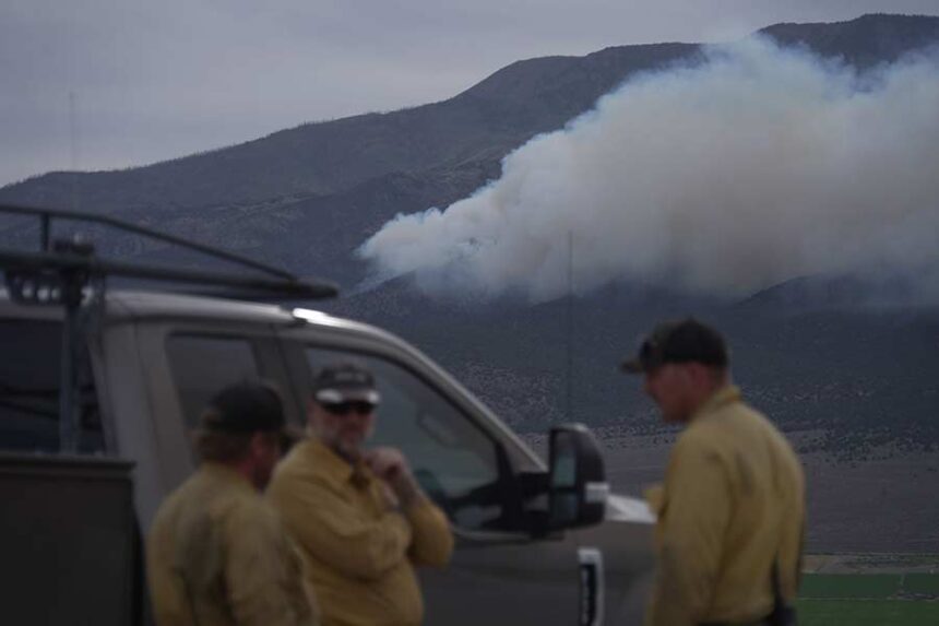 Firefighters gather near the Cottonwood Fire near Junction, Utah, on June 26. Mandatory Credit: Ty ONeil/AP via CNN Newsource