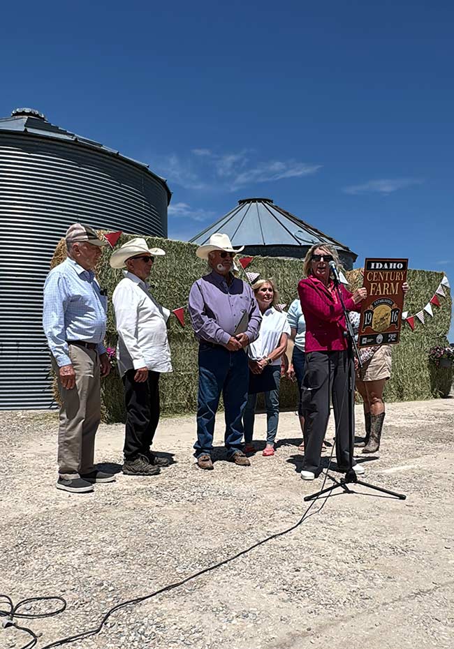 State official presenting Jeral Williams with the Idaho Century Farm award. | Courtesy Katie Williams