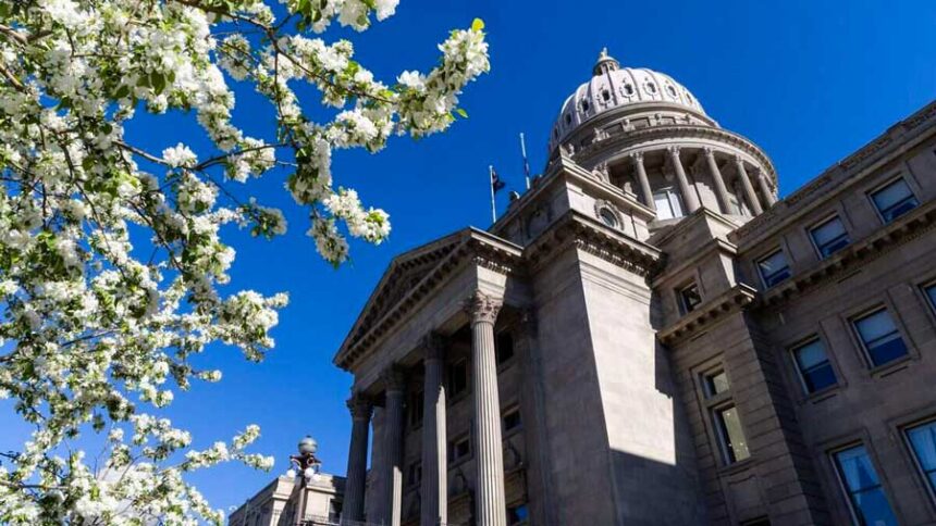 Idaho Statehouse in Boise, pictured with springtime blossoms.