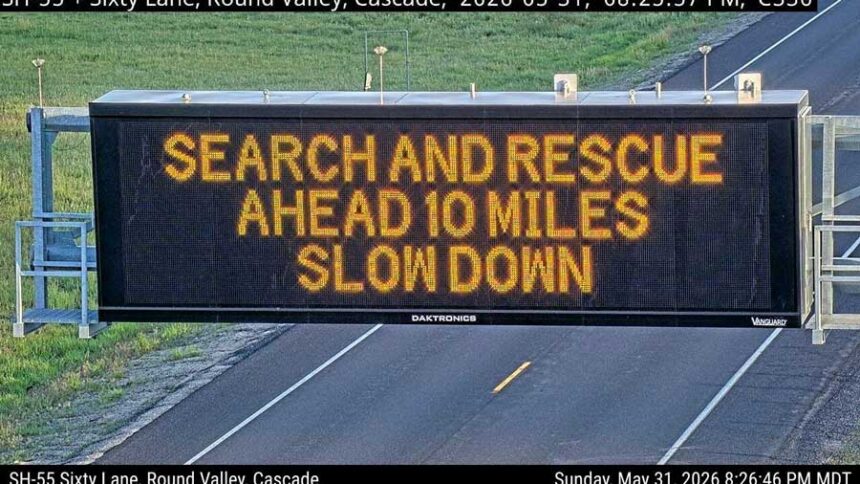 A roadway sign warns drivers to be cautious as they drive past an an area where search and rescue crews are looking for a person who was swept down the Payette River near Cascade following a car crash on Sunday. | Idaho 511
