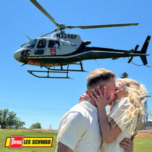 couple kisses in front of East Idaho News helicopter