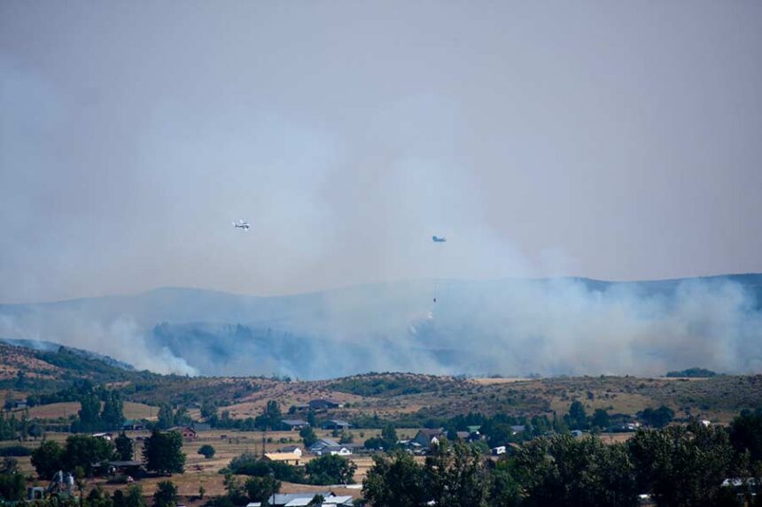 Wildfire emergency responders dump water on the Mesa Fire, which burned more than 16,500 acres, on July 27, 2018, near Council, Idaho. (Photo by Ron Bailey/Getty Images via Idaho Capital Sun)