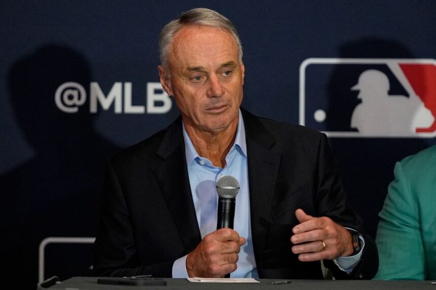 FILE - Commissioner of Major League Baseball Rob Manfred answers questions during a news conference at the MLB winter meetings, Dec. 8, 2025, in Orlando, Fla. (AP Photo/John Raoux, file)