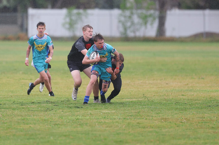 rugby muddy tackle