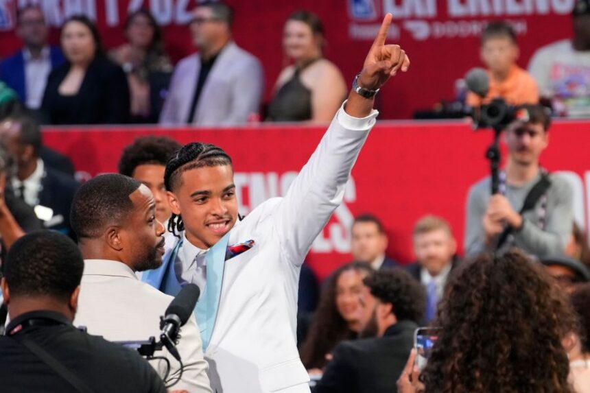 Mikel Brown Jr. gestures after being selected by the Brooklyn Nets with the No. 6 overall pick in the NBA Draftin the first round of the NBA basketball draft, Tuesday, June 23, 2026, in New York. (AP Photo/Yuki Iwamura)