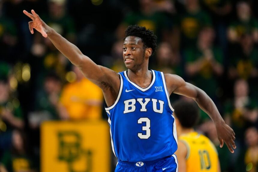 FILE - BYU forward AJ Dybantsa celebrates his three-pointer in the second half of an NCAA college basketball game against Baylor, Feb. 10, 2026, in Waco, Texas. (AP Photo/Tony Gutierrez, File)