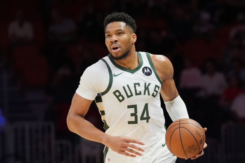 FILE - Milwaukee Bucks forward Giannis Antetokounmpo (34) dribbles the ball during the first half of an NBA basketball game against the Miami Heat, March 12, 2026, in Miami. (AP Photo/Marta Lavandier, File)