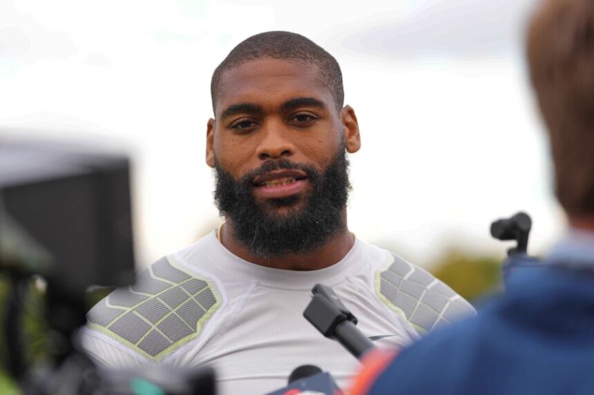 FILE - Denver Broncos' Jonathon Cooper speaks to the media at NFL football practice at Tottenham Hotspur training ground in London, Wednesday, Oct. 8, 2025. (AP Photo/Kirsty Wigglesworth, File)