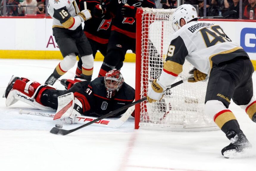 Carolina Hurricanes goaltender Frederik Andersen (31) stops a shot byf Vegas Golden Knights' Ivan Barbashev (49) during the third period in Game 2 of the NHL hockey Stanley Cup Final series in Raleigh, N.C., Thursday, June 4, 2026. (AP Photo/Karl DeBlaker)
