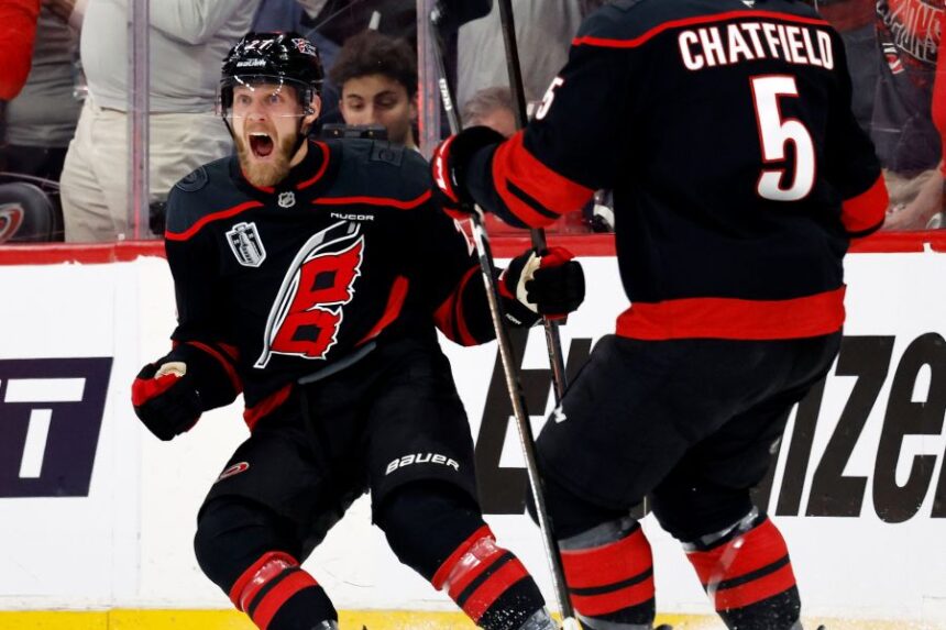 Carolina Hurricanes' Nikolaj Ehlers (27) celebrates his goal with Jalen Chatfield (5) during the first period in Game 1 of the NHL hockey Stanley Cup Final series against the Vegas Golden Knights in Raleigh, N.C., Tuesday, June 2, 2026. (AP Photo/Karl DeBlaker)