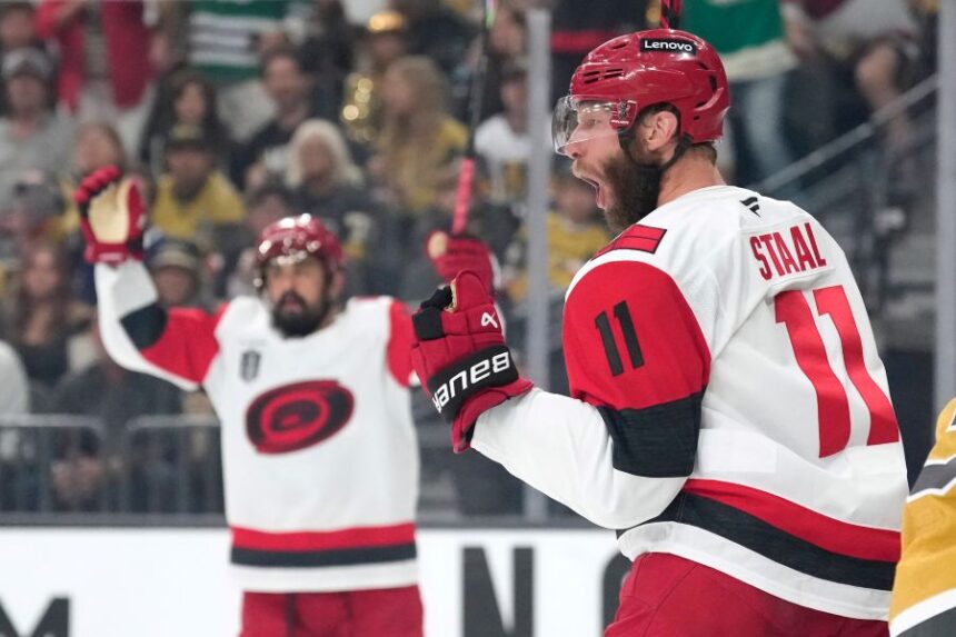 Carolina Hurricanes center Jordan Staal, right, celebrates his goal during the first period in Game 4 of the NHL hockey Stanley Cup Final series against the Vegas Golden Knights, Tuesday, June 9, 2026, in Las Vegas. (AP Photo/John Locher)