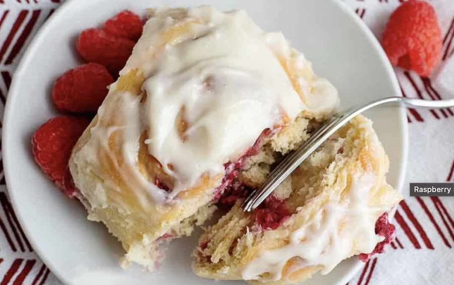 Homemade raspberry sweet rolls with light cream cheese glaze