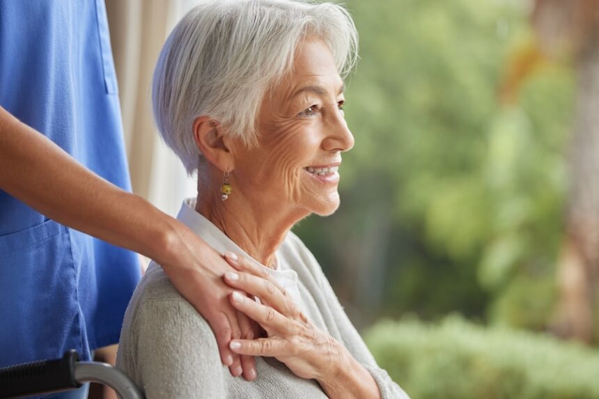 smiling senior woman receives care from nurse 2026 03 25 03 28 02 utc
