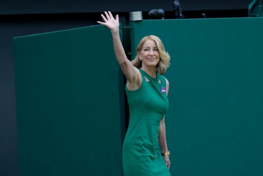 FILE - Former Wimbledon singles champion Chris Evert waves as she arrives for a 100 years of Centre Court celebration on day seven of the Wimbledon tennis championships in London, on July 3, 2022. (AP Photo/Kirsty Wigglesworth, File)