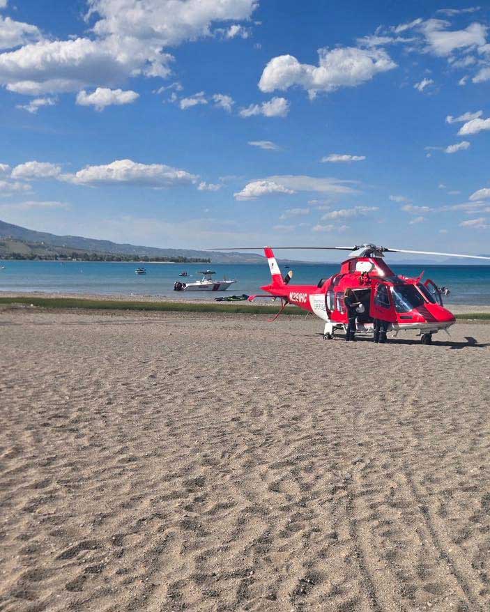 A medical helicopter is seen as police and paramedics respond to a drowning on Bear Lake's Ideal Beach, Saturday, June 6, 2026, in Garden City, Utah.
