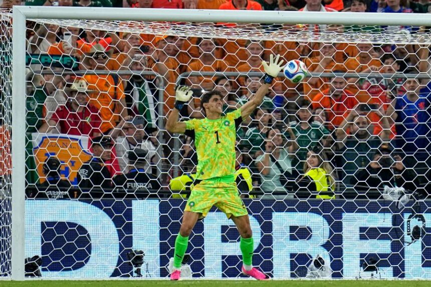 Morocco goalkeeper Yassine Bounou (1) saves a penalty from Netherlands' Crysencio Summerville (24) during the World Cup round of 32 soccer match between the Netherlands and Morocco in Guadalupe, near Monterrey, Mexico, Monday, June 29, 2026. (AP Photo/Ricardo Mazalan)