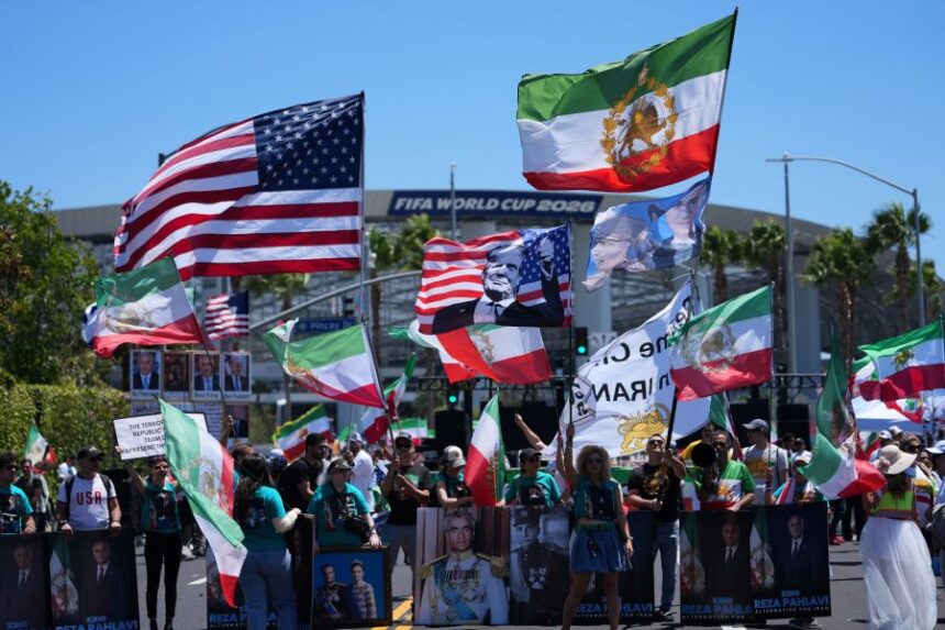 People protest outside Los Angeles Stadium before the World Cup Group G soccer match between Iran and New Zealand in Inglewood, Calif., near Los Angeles, Monday, June 15, 2026. (AP Photo/Jae C. Hong)