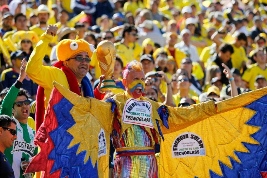 FILE - Colombian soccer fans cheer before a World Cup qualifying soccer game between Ecuador and Colombia in Quito, Ecuador, June 10, 2012. (AP Photo/Dolores Ochoa, File)