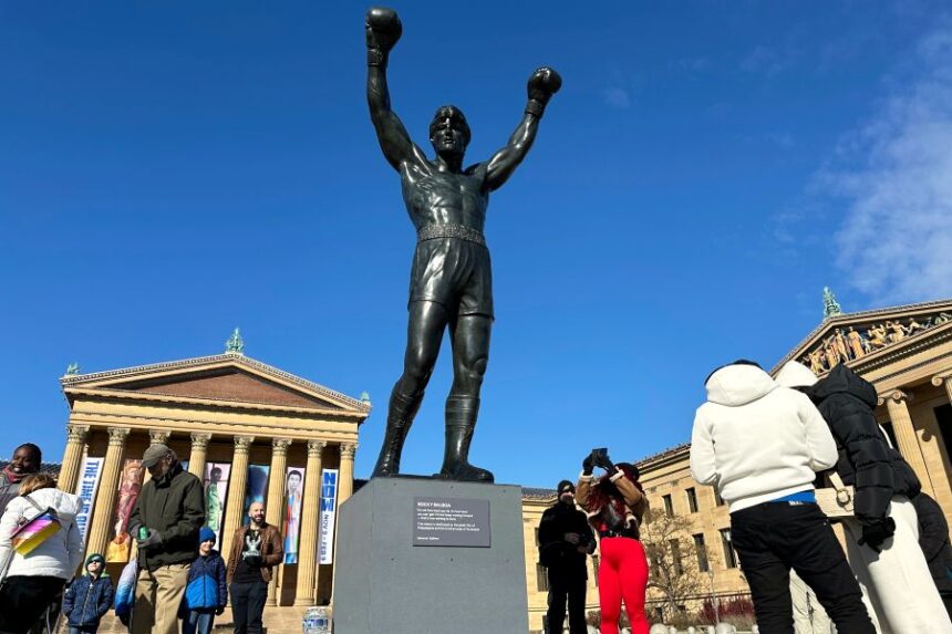 FILE - Visitors gather around the Rocky Statue during RockyFest 2024 at the Philadelphia Museum of Art, Dec. 3, 2024, in Philadelphia. (AP Photo/Tassanee Vejpongsa, File)