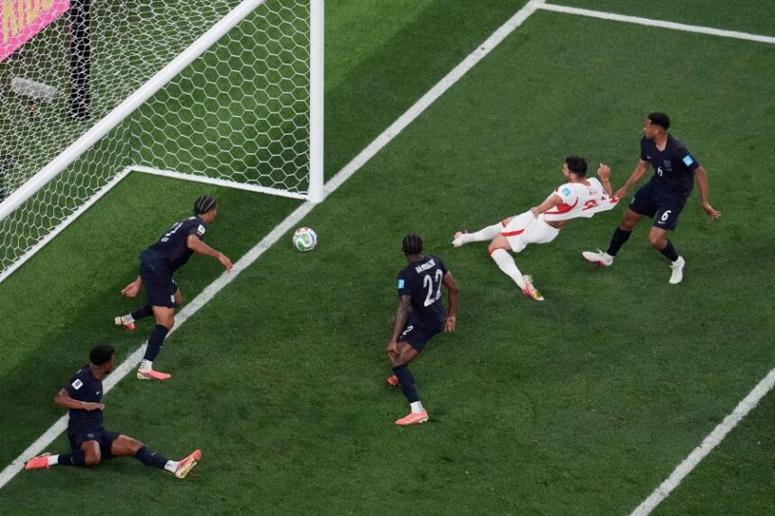 Turkey's Kaan Ayhan, second from right, scores their third goal as United States' Auston Trusty (6) defends and United States' Mark McKenzie (22) and United States' Miles Robinson (12) look on during the second half of a World Cup Group D soccer match in Inglewood, Calif., near Los Angeles, Thursday, June 25, 2026. (AP Photo/Marcio J. Sanchez)
