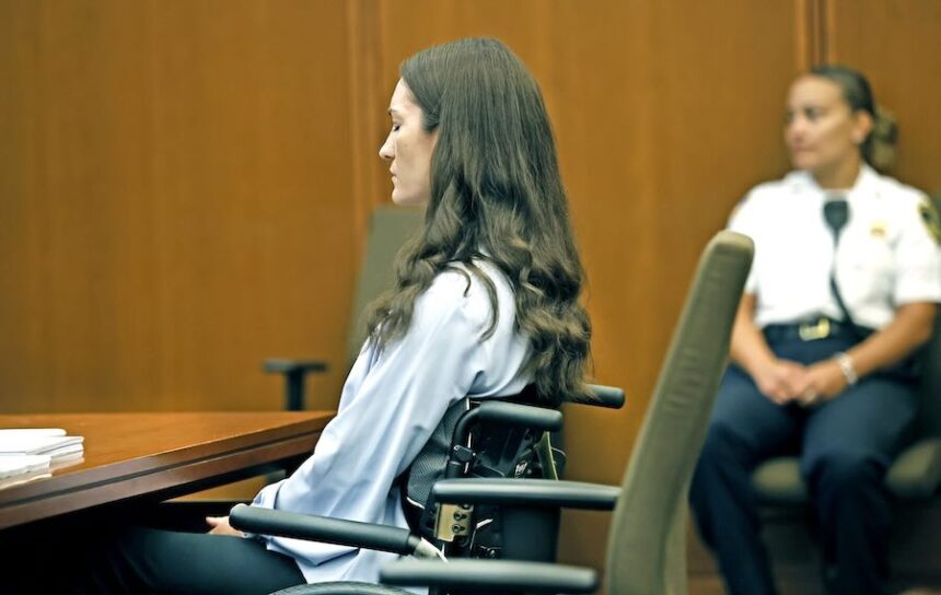 Lindsay Clancy listens as her attorney argues a motion before the start of her jury trial for the murders of her children.