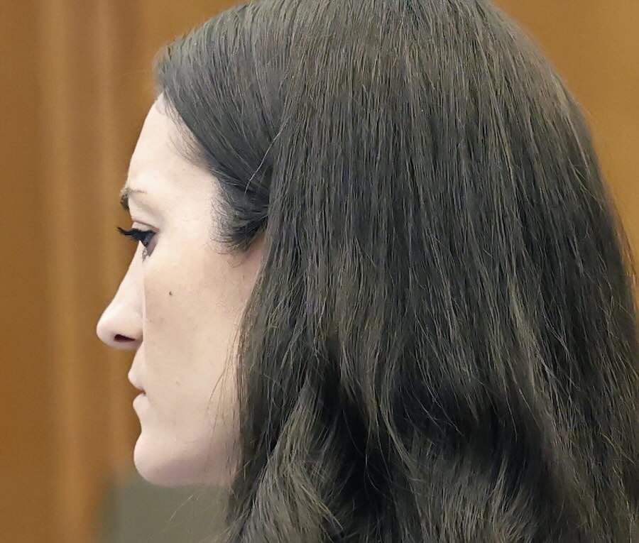 Lindsay Clancy listens as her attorney argues a motion before the start of her jury trial for the murders of her children.