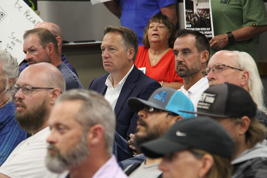 John Stenquist (left), a lawyer representing Lex Developments, and Gus Shultz (right) sit and listen during the meeting.