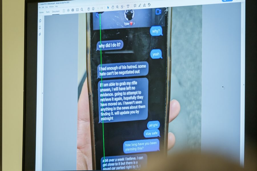 A photograph which prosecutors say shows a text message exchange between Tyler Robinson, who is accused in the fatal shooting of Charlie Kirk, and Robinson's roommate and romantic partner Lance Twiggs, is shown during a preliminary hearing at the Fourth District Courthouse in Provo, Utah, Thursday, July 9, 2026.