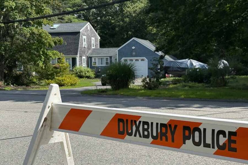 A police barricade stands outside the former home of Lindsay Clancy in Duxbury, Mass., on Friday, July 31, 2026.