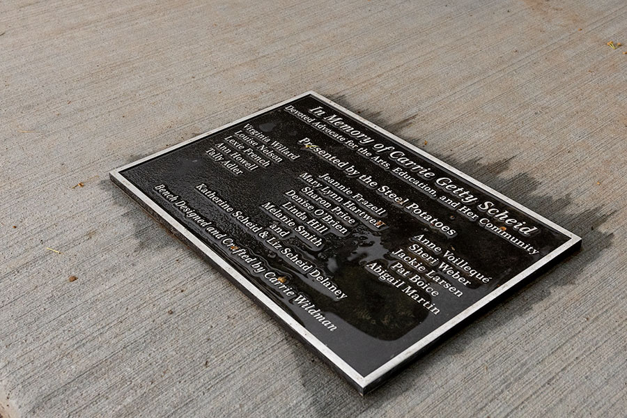A plaque on the new bench at the Idaho Falls River Walk that is dedicated in the memory of Carrie Getty Scheid, a longtime community leader in Idaho Falls. | Daniel V. Ramirez, EastIdahoNews.com
