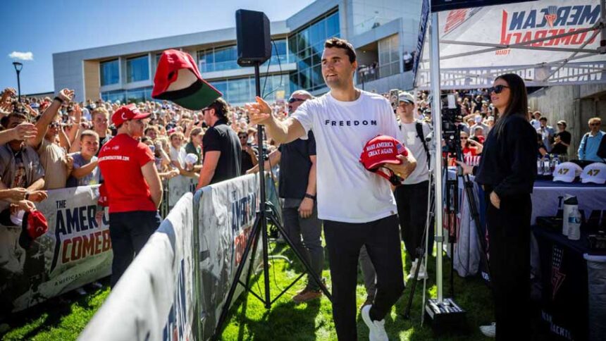 Charlie Kirk hands out hats before he was shot during Turning Point USA's visit to Utah Valley University in Orem, Sept. 10, 2025. A preliminary hearing for the alleged gunman, Tyler Robinson, is scheduled to begin Monday.