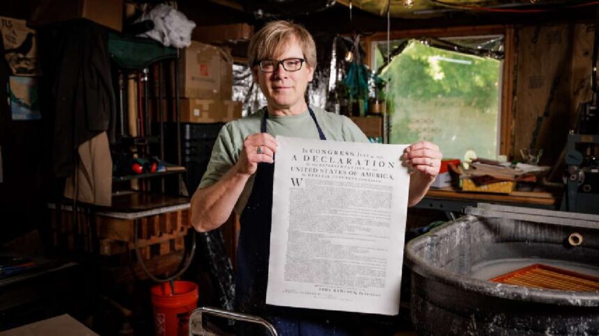 BYU adjunct professor Robert Buchert poses with his recreated Declaration of Independence. | Aaron Cornia, BYU