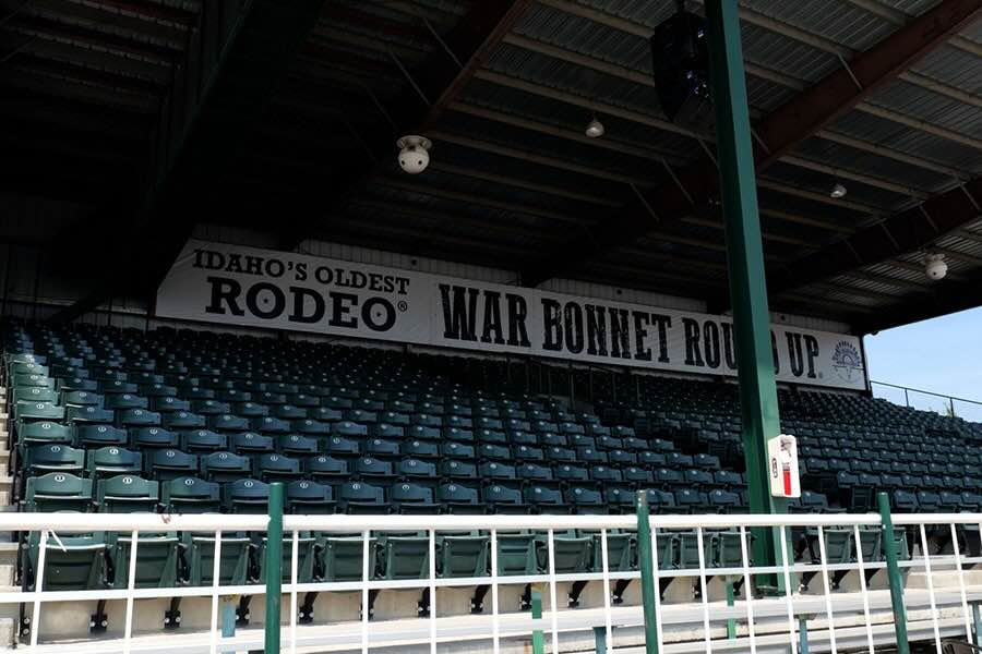 The grandstand at Sandy Downs shows an advertisement for the 115th annual War Bonnet Rodeo, which runs Thursday through Saturday.