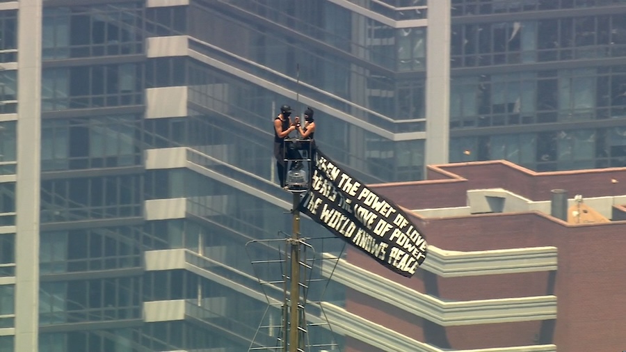 WATCH LIVE: Two people scale to top of Empire State Building carrying banner