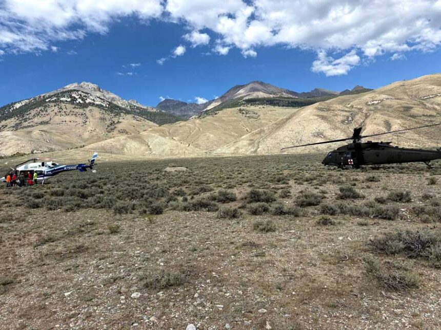 An Air St. Luke's helicopter (left) and an Idaho National Guard helicopter (right) help in a search and rescue operation on Mt. Idaho in Custer County on Saturday, July 18, 2026.