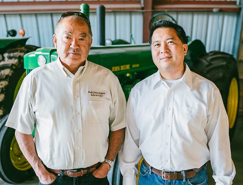 Frank Wada, left, with his grandson, Bryan. | Courtesy Wada Farms