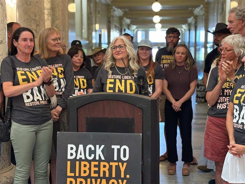 Volunteer organizer Suzanne Gallus speaks to fellow volunteers and supporters at an event at the Idaho Capitol on July 2. (Photo by Kelcie Moseley-Morris/Stateline)