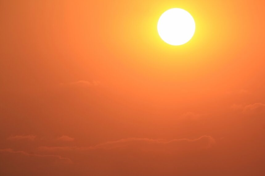 golden sun and orange sky at sunset, extreme heat, high temperatures, high temperature, heat illness