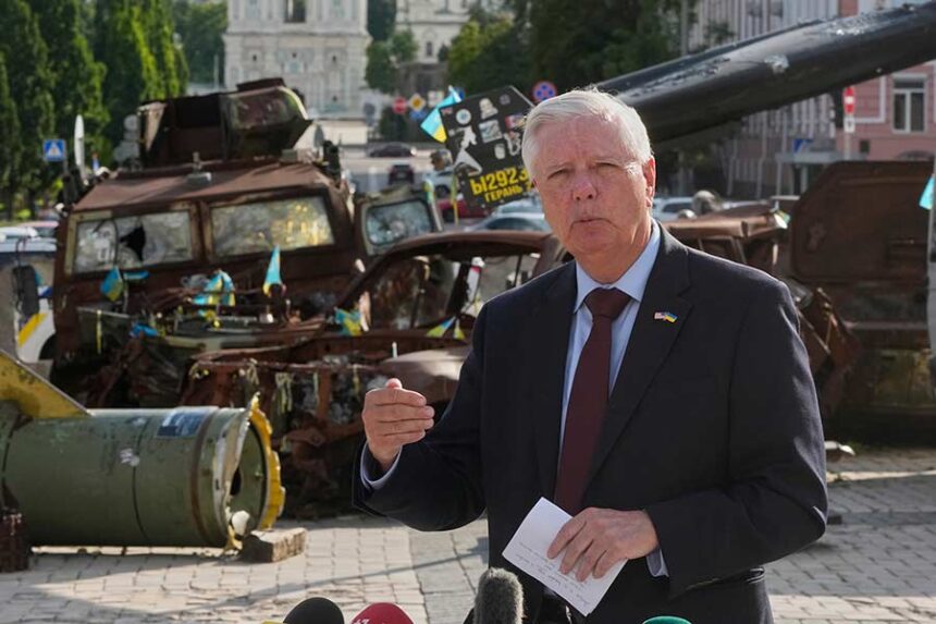 FILE - U.S. Sen. Lindsey Graham, R-S.C. answers questions from the media near an exhibition of damaged Russian vehicles in central Kyiv, on July 10, 2026. (AP Photo/Efrem Lukatsky, File)