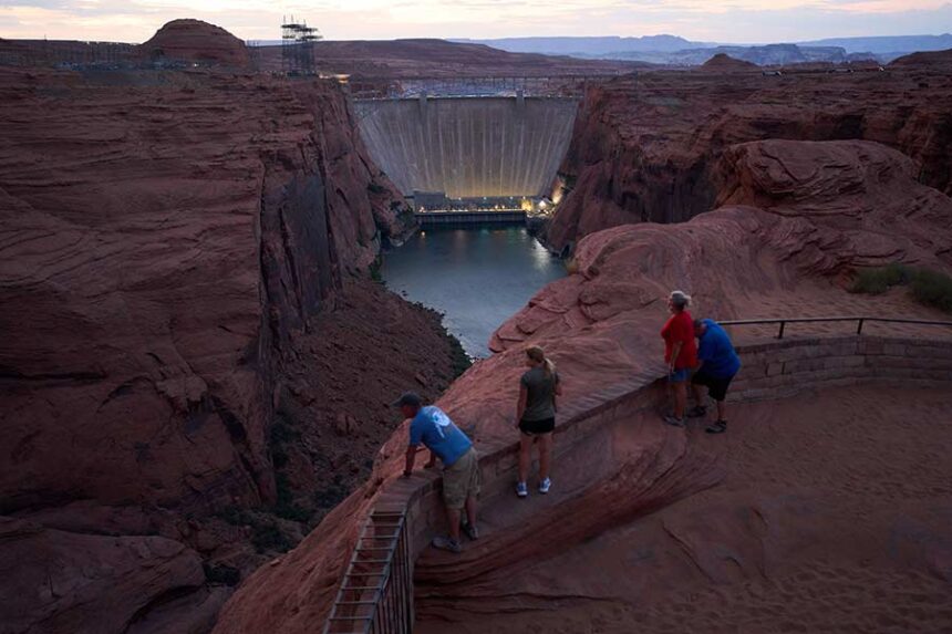 The Glen Canyon Dam from a viewpoint above the Colorado River, on July 14, 2026, in Page, Arizona. Mandatory Credit: John Locher/AP via CNN Newsource