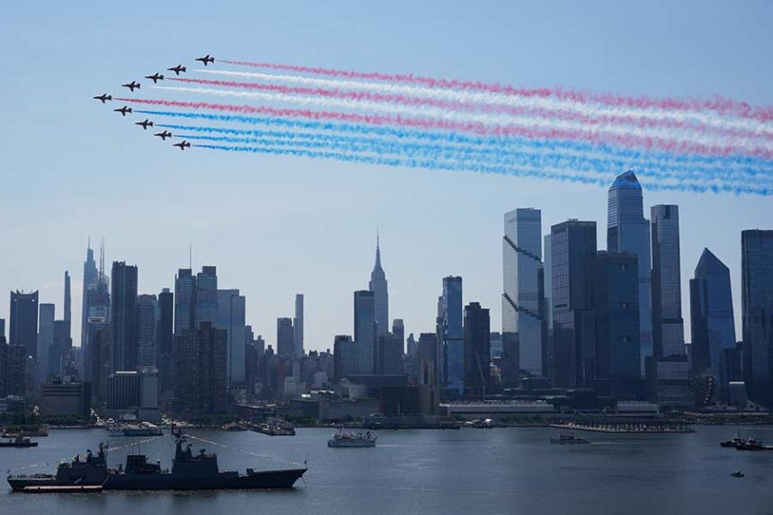 Military planes perform a flyover of the Hudson River, above the the Manhattan skyline, as seen from Weehawken, N.J., Saturday, July 4, 2026. (AP Photo/Seth Wenig)
