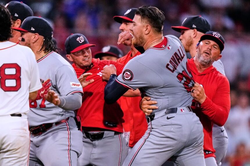 Boston Red Sox's Willson Contreras (40) is held back as tempers flare during the fourth inning of a baseball game against the Washington Nationals, Tuesday, June 30, 2026, in Boston. (AP Photo/Charles Krupa)