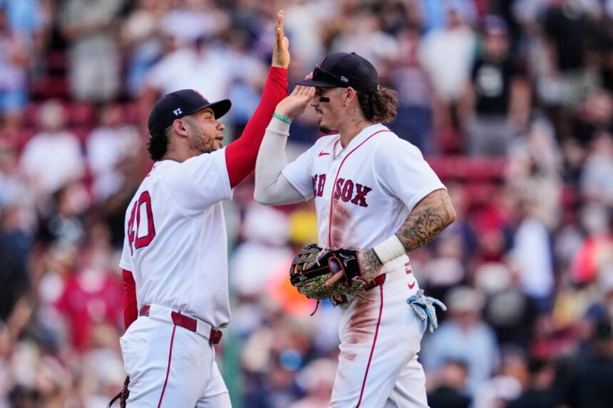 Boston Red Sox's Jarren Duran, right, celebrates with Willson Contreras after they defeated the Baltimore Orioles in the first baseball game of a doubleheader, Wednesday, July 22, 2026, in Boston. (AP Photo/Charles Krupa)
