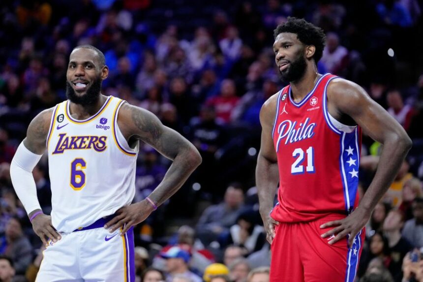 Los Angeles Lakers' LeBron James and Philadelphia 76ers' Joel Embiid play during an NBA basketball game, Friday, Dec. 9, 2022, in Philadelphia. (AP Photo/Matt Slocum, File)