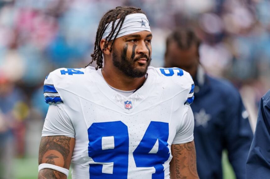 FILE - Dallas Cowboys defensive end Marshawn Kneeland (94) looks on during an NFL football game between the Carolina Panthers and the Dallas Cowboys on Oct. 12, 2025, in Charlotte, N.C. (AP Photo/Jacob Kupferman, File)