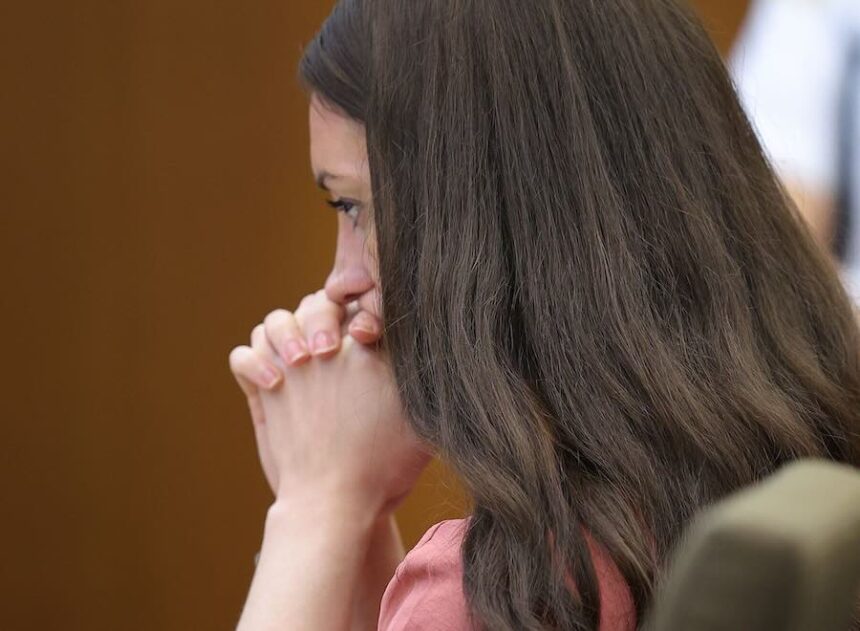 Lindsay Clancy sits at the defense table, listening to witness testimony in her murder trial in the Plymouth Superior Court, Monday, Aug. 3, 2026, in Plymouth Mass.