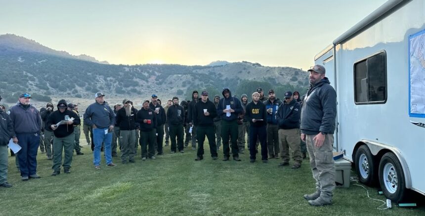 Firefighters in their morning meeting before heading up to hill to fight the Big Rock Fire. | USWFS Great Basin
