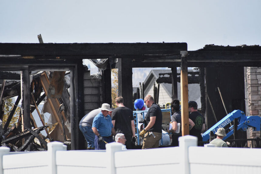 Investigators work at the scene Tuesday, Aug. 25, 2026, where a family was killed and the house burned in Billings, Montana. | Matthew Brown, Associated Press