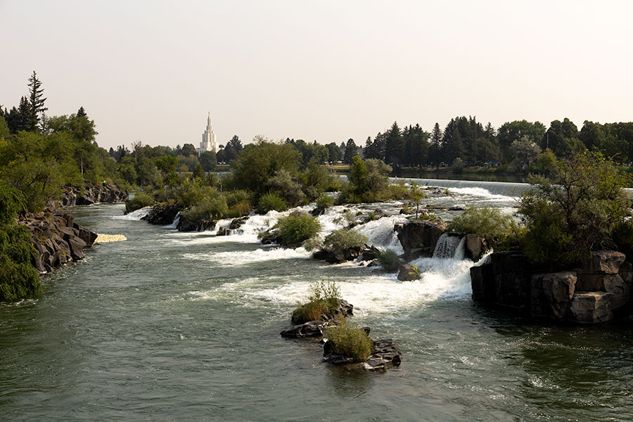 Smokey skies are seen over the Idaho Falls Temple and Snake River, on Thursday, Aug. 6, 2026, in Idaho Falls. Several counties in East Idaho are under an air quality advisory due to wildfire smoke.